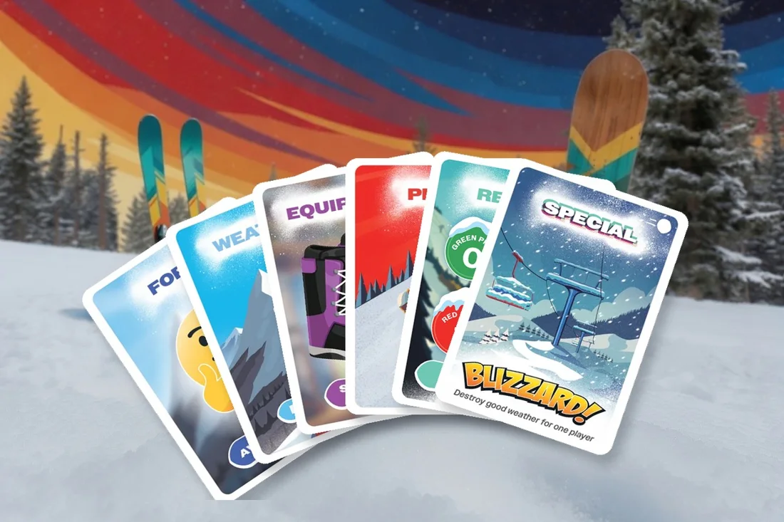 Fan of six Ready Steady Slope cards in the snow, one of each type